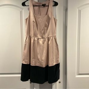 Beautiful light pink silk material on top and black suede material at bottom.